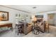 Cozy living room with a fireplace, comfortable seating, and ample natural light at 965 E Gondola Dr, Venice, FL 34293