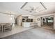 Spacious living room flows into the kitchen with bar seating, seamlessly connecting to the dining area at 965 E Gondola Dr, Venice, FL 34293