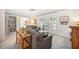 Cozy living room offers bright shutters for natural light, comfortable seating and built-in shelving at 965 E Gondola Dr, Venice, FL 34293