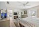 Carpeted main bedroom featuring a fireplace, tiled flooring, and direct access to the outdoor pool area at 965 E Gondola Dr, Venice, FL 34293