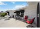 Charming outdoor patio with comfortable seating, a decorative fountain, and an awning at 965 E Gondola Dr, Venice, FL 34293