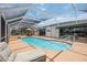 Relax by the screened-in pool with an integrated spa, and plenty of patio space at 965 E Gondola Dr, Venice, FL 34293