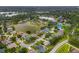 Aerial view of a suburban community with multiple lakes, lush green spaces, and well-maintained homes at 11022 Pine Lilly Pl, Lakewood Ranch, FL 34202