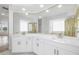 This bathroom boasts double sinks, modern fixtures, and marble countertops at 11022 Pine Lilly Pl, Lakewood Ranch, FL 34202
