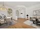 Bright and elegant living area with hardwood floors, stylish decor, and abundant natural light at 11022 Pine Lilly Pl, Lakewood Ranch, FL 34202