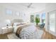 Serene bedroom with a bay window, hardwood floors, and a door that leads to the pool at 11022 Pine Lilly Pl, Lakewood Ranch, FL 34202