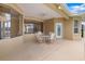 Covered outdoor patio featuring comfortable seating, perfect for enjoying the fresh air at 11022 Pine Lilly Pl, Lakewood Ranch, FL 34202