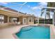 Inviting pool featuring sun-drenched patio seating, surrounded by manicured greenery and a screened enclosure at 11022 Pine Lilly Pl, Lakewood Ranch, FL 34202