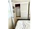 Bedroom closet with ample hanging space and built-in storage in a naturally lit room at 1010 49Th W Ave, Bradenton, FL 34207