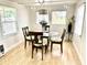 Inviting dining area with stylish chairs, a modern light fixture, and bright natural light at 1010 49Th W Ave, Bradenton, FL 34207