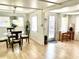 Cozy dining area with a round glass table and plenty of natural light at 1010 49Th W Ave, Bradenton, FL 34207