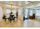 Cozy dining area with a round glass table and plenty of natural light at 1010 49Th W Ave, Bradenton, FL 34207