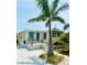 Charming home featuring a well-maintained exterior with a sunny patio and tropical landscaping at 1010 49Th W Ave, Bradenton, FL 34207
