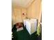 Convenient laundry room with washer and dryer, storage, and functional layout at 1010 49Th W Ave, Bradenton, FL 34207