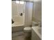 Standard bathroom features a shower and tub combination, toilet, and a white sink at 104 22Nd Street E Ct, Bradenton, FL 34208