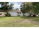 Quaint single-story home with a yard and mature trees at 104 22Nd Street E Ct, Bradenton, FL 34208