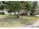 Modest single-story home with vehicles parked in the driveway at 104 22Nd Street E Ct, Bradenton, FL 34208