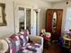 Cozy living room featuring a comfortable couch and a classic armoire at 104 22Nd Street E Ct, Bradenton, FL 34208