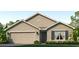 Charming one-story home with a two-car garage and well-manicured lawn and landscaping at 10824 Gentle Current Way, Parrish, FL 34219