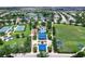 Aerial view of the community featuring a tennis court, playground, splash pad, pavilion, and soccer field at 11794 Forest Park Cir, Bradenton, FL 34211