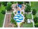 Aerial view of the splash pad featuring playground equipment, picnic tables, and benches at 11794 Forest Park Cir, Bradenton, FL 34211