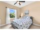 Comfortable bedroom with a ceiling fan, a comfortable bed, and ample natural light for a serene atmosphere at 11794 Forest Park Cir, Bradenton, FL 34211