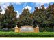 A community sign for Central Park at Lakewood Ranch behind hedges and in front of trees at 11794 Forest Park Cir, Bradenton, FL 34211