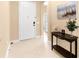 Bright foyer with tiled flooring, a decorative table, and a view of the interior at 11794 Forest Park Cir, Bradenton, FL 34211