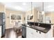 Bright kitchen featuring stainless steel appliances, granite countertops, and a cozy breakfast nook with backyard views at 11794 Forest Park Cir, Bradenton, FL 34211