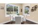 Breakfast nook featuring a round table, flooded with natural light and picturesque views of the outdoors at 11794 Forest Park Cir, Bradenton, FL 34211