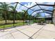 Expansive screened-in patio featuring outdoor seating and a view of the serene backyard at 11794 Forest Park Cir, Bradenton, FL 34211