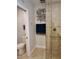 Bathroom showing a glass shower with neutral tiles and modern metal art and towel hooks at 1241 Riverscape St # B, Bradenton, FL 34208