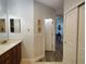 Bathroom with modern vanity and mirror; hallway and closet are visible in the background at 1241 Riverscape St # B, Bradenton, FL 34208