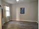 Bedroom with neutral walls and floors, a ceiling fan, and natural light from the window at 1241 Riverscape St # B, Bradenton, FL 34208
