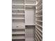 Walk-in closet featuring custom shelving and ample storage space for clothes and accessories at 1241 Riverscape St # B, Bradenton, FL 34208