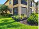 Beautiful exterior of the building with lush green landscaping and vibrant foliage at 1241 Riverscape St # B, Bradenton, FL 34208