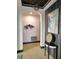 Stylish foyer featuring a console table, decorative wall art, and an open archway at 1241 Riverscape St # B, Bradenton, FL 34208