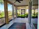 Cozy lanai area with a rug and slider doors leading to an outdoor patio at 1241 Riverscape St # B, Bradenton, FL 34208