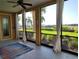 Relaxing screened-in lanai with curtains and views of the beautiful waterfront at 1241 Riverscape St # B, Bradenton, FL 34208