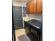 Functional laundry room with modern washer and dryer, wood cabinets, and sink at 1241 Riverscape St # B, Bradenton, FL 34208