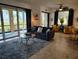 Bright living room with tile floors, comfortable seating, and sliding glass doors leading to an outdoor view of water at 1241 Riverscape St # B, Bradenton, FL 34208