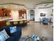 Open-concept living space with kitchen island, stainless appliances, and adjacent dining area provides ample room for entertaining at 1241 Riverscape St # B, Bradenton, FL 34208
