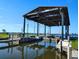 Community boat lift providing convenient access to the waterway, perfect for boating enthusiasts at 1241 Riverscape St # B, Bradenton, FL 34208