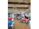 Spacious clubhouse area with tables and chairs, ideal for community events and celebrations at 1241 Riverscape St # B, Bradenton, FL 34208
