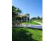 Community park featuring a bench, paved walkway, shade structure, and lush green landscaping for relaxation at 1241 Riverscape St # B, Bradenton, FL 34208