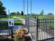 Fenced dog park featuring a walking path and grassy area for pets and owners to enjoy at 1241 Riverscape St # B, Bradenton, FL 34208