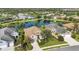 Beautiful aerial view of neighborhood homes backing to a lake surrounded by lush landscaping at 12908 Crystal Clear Pl, Bradenton, FL 34211