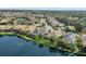 A stunning aerial view showcases the well-maintained homes within the community, complete with serene lake views at 12908 Crystal Clear Pl, Bradenton, FL 34211