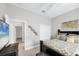 This cozy bedroom has a ceiling fan, closet, and a doorway leading to the rest of the home at 12908 Crystal Clear Pl, Bradenton, FL 34211