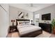 Well-lit bedroom featuring a comfortable bed, modern decor, and ample natural light at 12908 Crystal Clear Pl, Bradenton, FL 34211